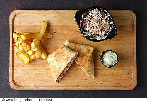 Quesadilla with fried potato  salad with white and red cabbage and garlic sauce
