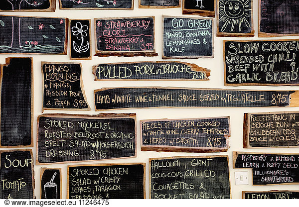 Quirky coffee shop interior with menu on chalked blackboards