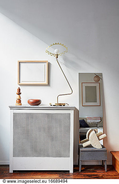 Radiator with lamp wood objects  picture frames