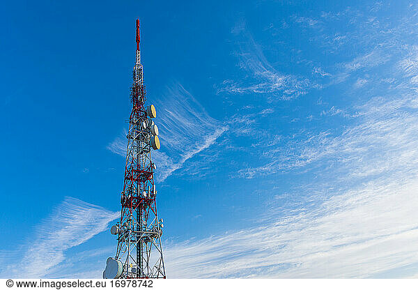 radio communication antenna on blue sky background