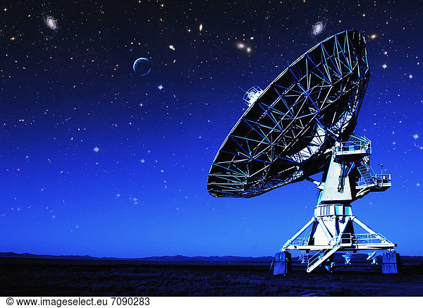 Radio telescopes in the landscape in New Mexico. Night. Antennae in rows.