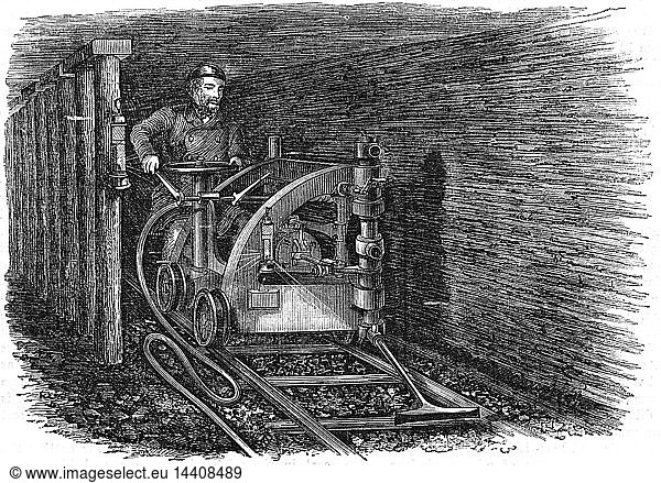 Rail mounted coal cutting machine powered by compressed air produced by a steam engine at the pithead. Wood engraving 1864