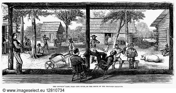 RAILROAD CREW  1877. Convict laborers from a railroad crew in western Louisiana under close supervision at a camp along the route of the proposed New Orleans Pacific Railroad  1877. Wood engraving from a contemporary American newspaper.