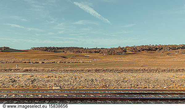 Railway and country landscape with blue sky