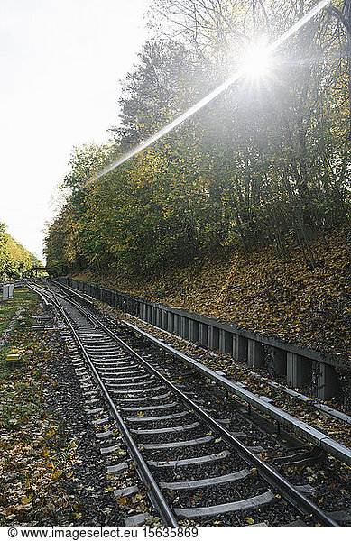 Railway tracks of a metro line in backlight  Berlin  Germany