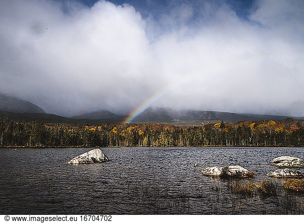 Rainbow forms over Sandy Stream Pond  Baxter State Park  Maine