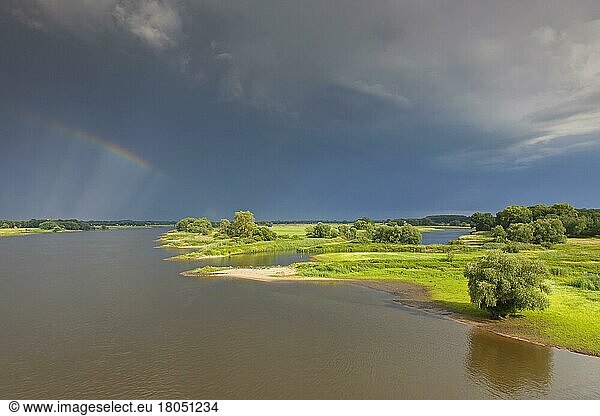 Rainbow over the Elbe River Landscape UNESCO Biosphere Reserve in summer  Lower Saxony  Germany  Europe