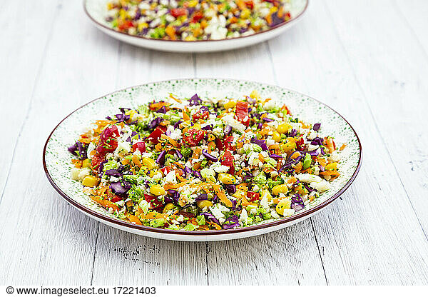 Rainbow salad made out of broccoli  carrot  corn  cauliflower  red cabbage  red bell pepper