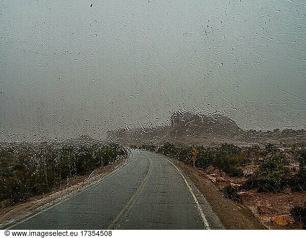 Raindrops on a car window  driving in the rain  Arches Scenic Drive  Arches National Park  Utah  USA  North America