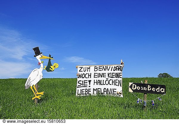 Rattling stork and banner as a welcome for a newborn child  Seeham  Salzburg Lakeland  Salzburger Land  Austria  Europe