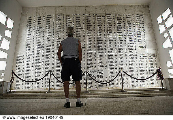 Rear view of a man standing in the shrine room  USS Arizona Memorial at Pearl Harbor  Honolulu  Hawaii  USA.