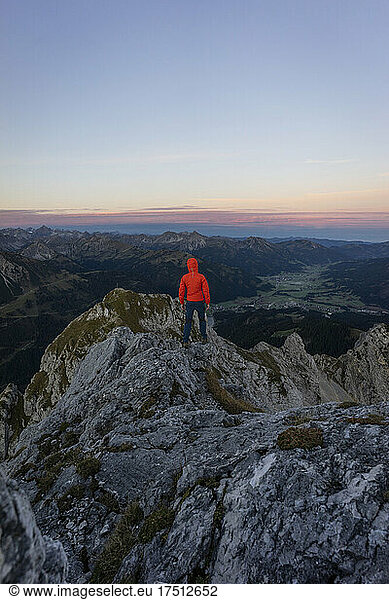 Rear view of hiker on viewpoint during sunrise  Gimpel  Tyrol  Austria