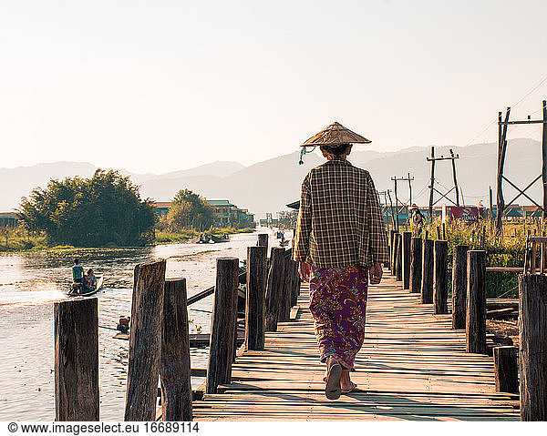 rear view of local woman walking in Myanmar