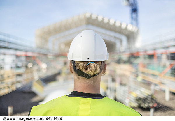 Rear view of male construction worker at site