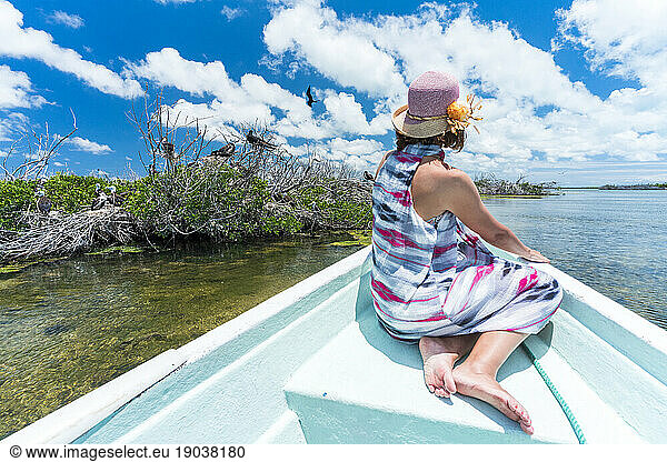 Rear view of woman on boat tour at Frigate birds Sanctuary  Barbuda