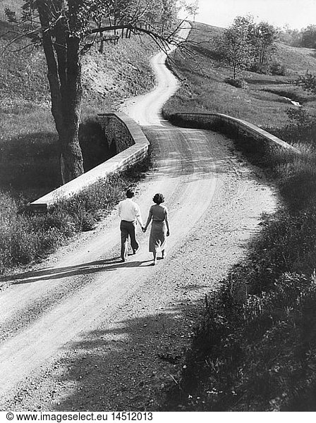 Rear View Portrait of Couple Walking Down Rural Road  Pennsylvania  USA  Philip D. Gendreau for Farm Security Administration  1930