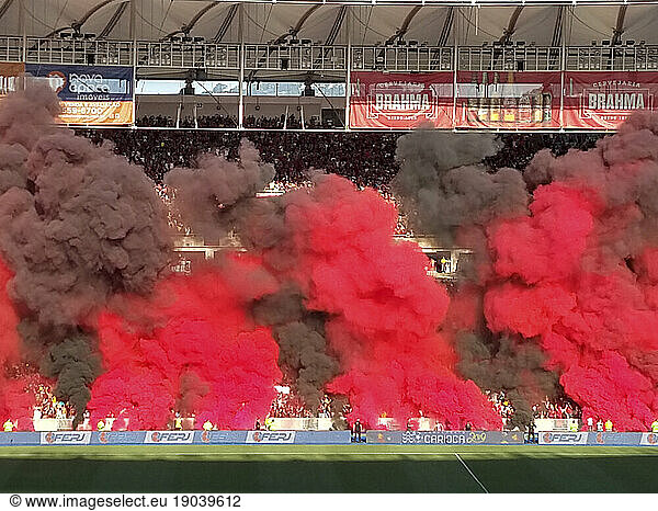 Red and black smoke in Maracana Stadium final soccer match