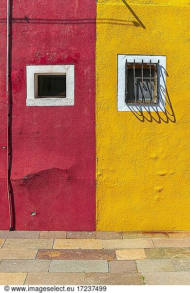 Red and yellow wall with window  colorful house wall  colorful facade  Burano Island  Venice  Veneto  Italy  Europe