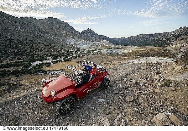 Red beach buggy on sandy track  Alexandros crater behind  caldera of Alexandros and Stefanos crater  Nisyros  Dodecanese  Greece  Europe