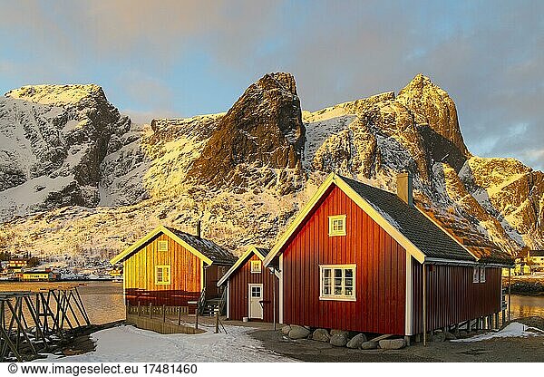 Red boathouse in winter landscape  Scandinavian boathouse  mountains  snow  fjord  sea  Reine  Nordland  Lofoten  Norway  Europe