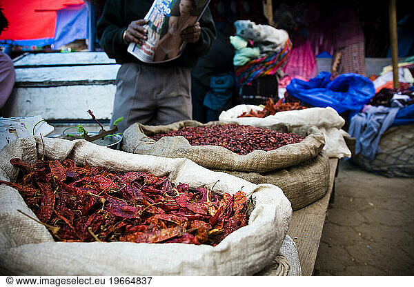 Red chile peppers are sold in a local market in Chichicastenango  Guatemala.