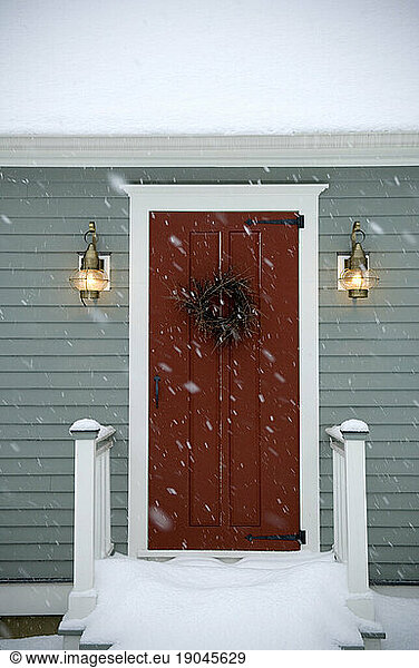 Red door on classic New England Cape  Maine.