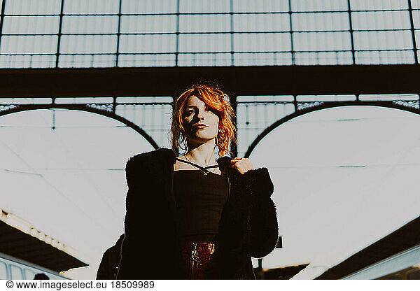 red-haired woman in train station