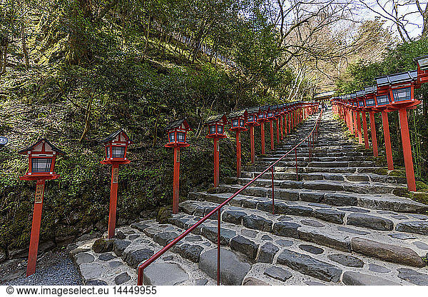 Red lanterns along stone steps near Kyoto  Japan.