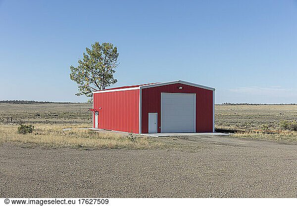 Red Metal Barn in a prairie landscape.