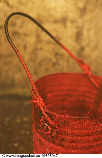 Red paint bucket.