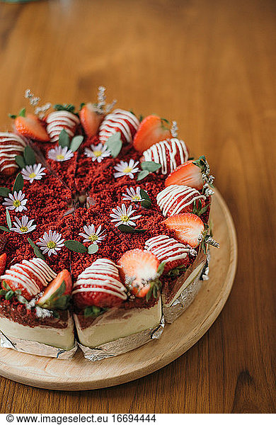 Red Velvet Strawberry cake on wooden table