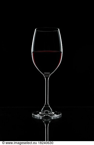 Red wine in a glass isolated on black background  realistic photo image  with clip path