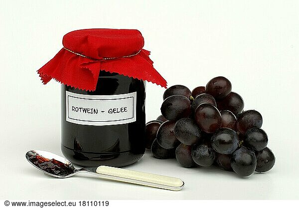 Red wine jelly in glass and grapes  red wine jelly  spoon