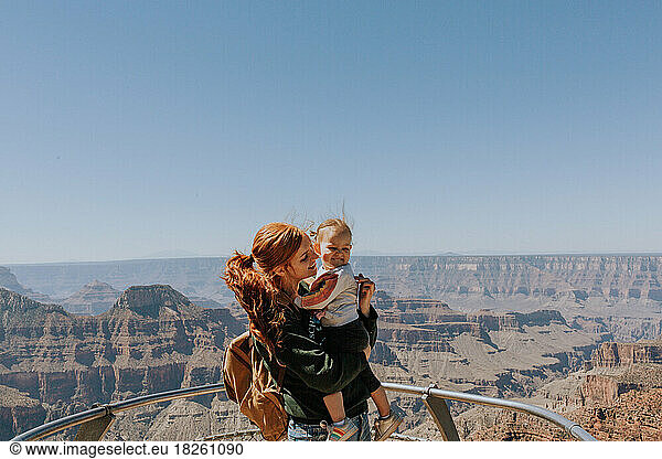 Redhead mother and daughter standing outside by the North Rim of