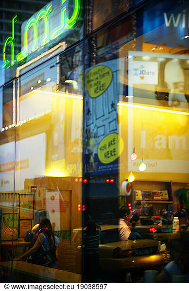 Reflection in window  Times Square  NYC.