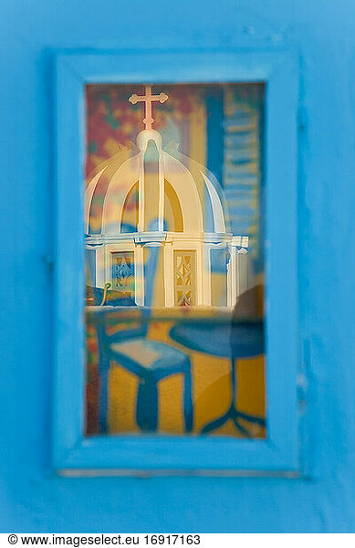 Reflection of church in picture window  Santorini  Cyclades Islands  Greece