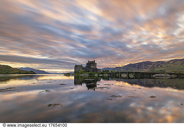 Reflection of Eilean Donan castle at sunset