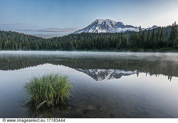 Reflection of Mount Rainier in Reflection Lake in Mout Rainier national park at dawn.