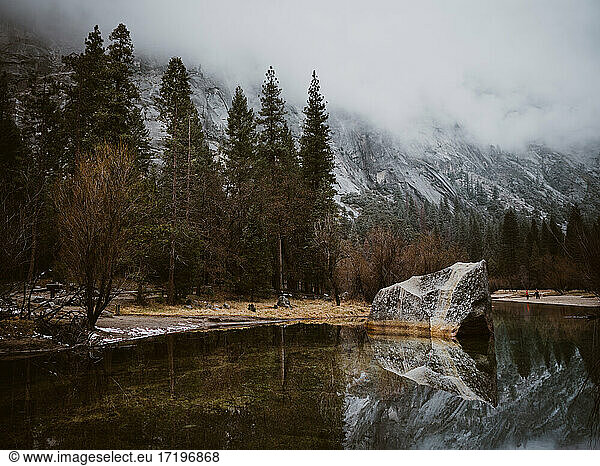 Reflection of rocks and trees at mirror lake in Yosemite