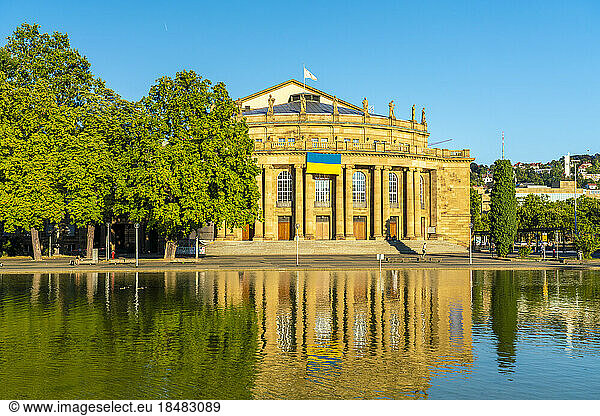 Reflection of Staatstheater in water on sunny day  Stuttgart  Germany