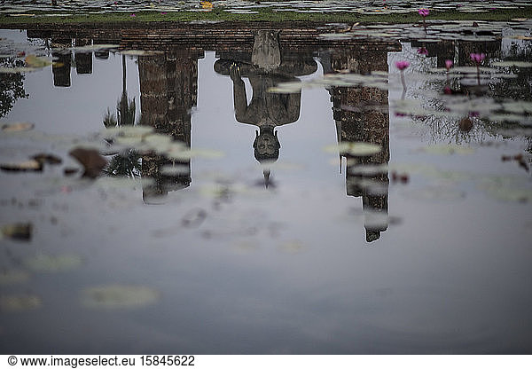 Reflections at the Wat Mahatat temple   Sukhothai Historical Park  Sukhothai  Thailand.