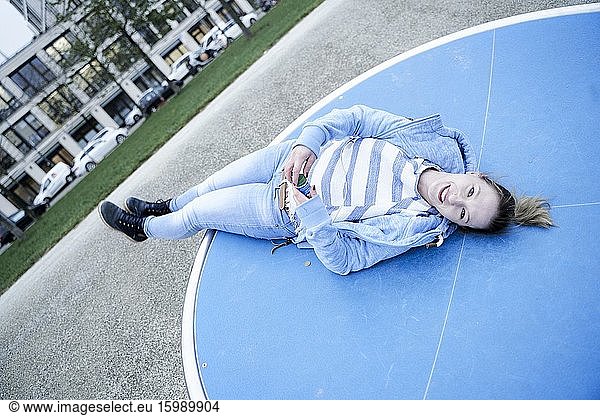 Relaxed woman in playground