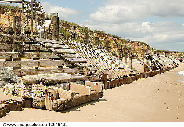 Remains of wooden sea and breakwater defences. Happisburgh  North Norfolk Coast  UK.