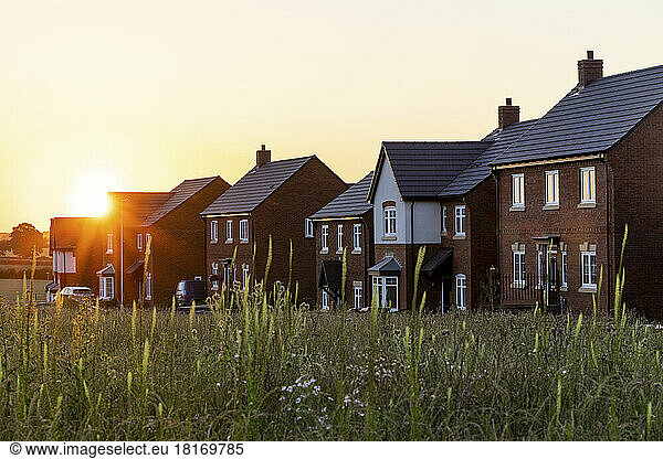Residential detached houses in town at sunset