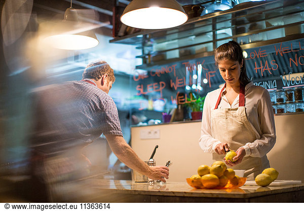 Restaurant owners working in kitchen