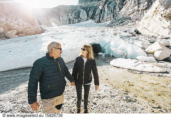 Retired couple enjoying life during outdoor tour to ice cave.