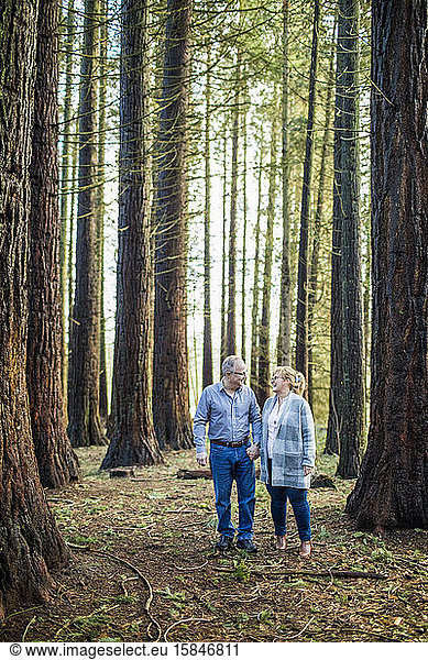 Retired couple walking in nature  enjoying their freedom.