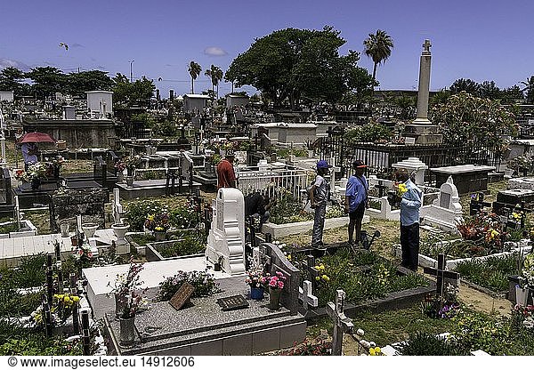Reunion Saint Pierre Graveyard On the occasion of All Saints' Day the graves are flowered and the families come to collect The cemetery contains tombs of different religions and cults