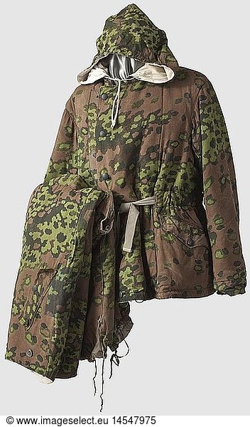 Reversible winter suit for the Waffen-SS in spring camouflage pattern  Lined in brown-green oak leaf pattern camouflage reversible to white. The jacket with bluish metal and white paste buttons  complete with hood and all ties. The trousers of the same issue. Slight signs of use. Repaired and with faults in places  historic  historical  1930s  20th century  Second World War / WWII  object  objects  clipping  cut out  cut-out  cut-outs  stills  military  militaria  uniform  uniforms  clothes  textile  outfit  outfits  wearings  camouflage  camouflages