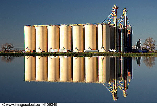 Rice Silos and Flooded Rice Field
